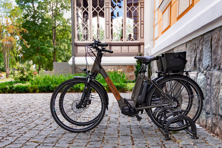 ESTONIA, VILJANDI, SEPTEMBER, 2022: Guest bikes Schloss Fellin in the parking lot next to the hotel in Viljandi, Southern Estonia. Hotel provides bicycles for hotel guests to enjoyのeditorial素材