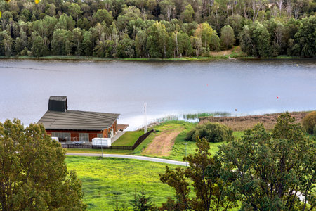 ESTONIA, VILJANDI, SEPTEMBER, 2022: Small summer wooden cottage on the lake shore with dense forest in Viljandi County, Estonia.のeditorial素材