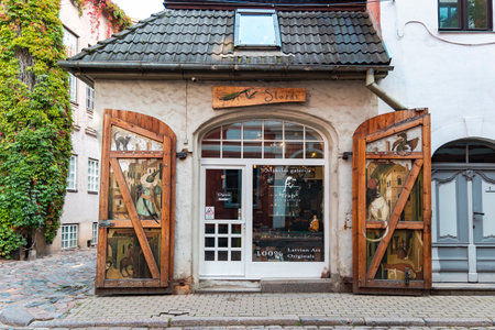 LATVIA, RIGA, OCTOBER, 2022: Beautiful old street of Riga Old Town with low houses and cozy art shop. Riga city historical centre is a UNESCO World Heritage Siteのeditorial素材