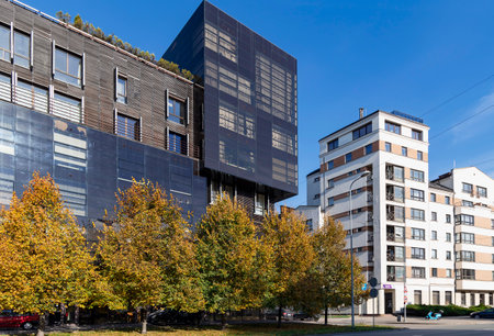 LATVIA, RIGA, OCTOBER, 2022: Modern architecture of Riga city center surrounded by autumn park in Riga, Latviaのeditorial素材