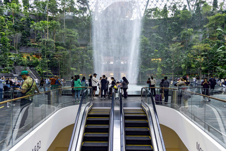 Southeast Asia, Singapore, November, 2022: Jewel Changi Airport with Rain Vortex - a waterfall at the airport in Singapore.のeditorial素材