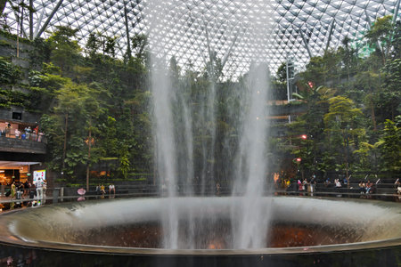 Southeast Asia, Singapore, November, 2022: Jewel Changi Airport with Rain Vortex - a waterfall at the airport in Singapore. The spectacular waterfall is a new tourist attraction ofのeditorial素材
