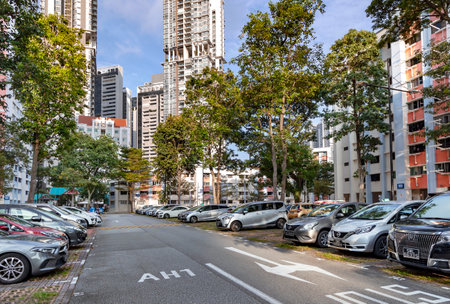 Southeast Asia, Singapore, November, 2022: Car parking in modern high-rise residential apartments buildings with a quality landscaping in Singapore. Green environment concept.のeditorial素材