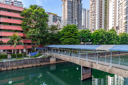 Southeast Asia, Singapore, November, 2022: Modern high-rise residential buildings with a beautiful tropical garden on the banks of the city canal in Singapore. Residential propertyのeditorial素材