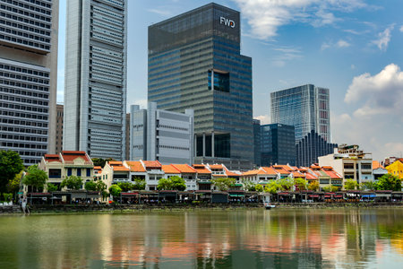 Southeast Asia, Singapore, November, 2022: Modern high-rise residential buildings and two-story mansions in the colonial English style by the river in Singapore.のeditorial素材