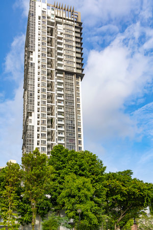 Modern high-rise residential buildings with a beautiful tropical garden in Singapore. Concept of green environment in the city.の写真素材
