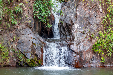 <p>Beautiful deep forest waterfall in Thailand. A cascading waterfall in the woods during summer. South-East Asia.</p>の写真素材