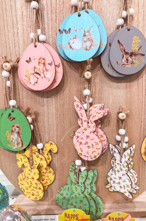 Wooden decorative eggs and rabbit for Easter on store shelves. Easter holiday concept, spring mood.の写真素材