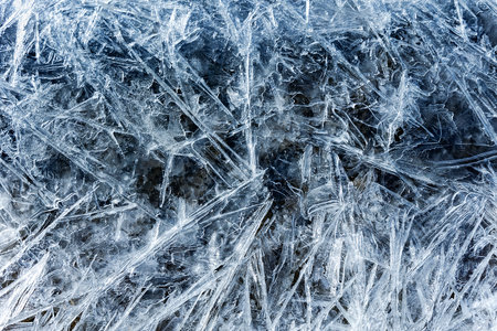 Blue melting ice texture. Texture of ice shards. Winter background. Fragmented ice crystalsの写真素材