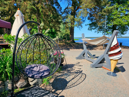 An open veranda of a summer cafe on the shore Kisezers lake - one of the largest freshwater lakes with access in the Baltic Sea. Riga, Latviaの写真素材