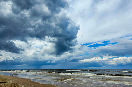 Lush cumulus clouds over Baltic sea in Jurmala, Latvia. nature environment concept. Cumulus clouds...