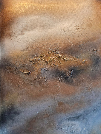 Artistic wall with gold plating and texture of creative putty. Allegory of the erosion of the Earth. Great background or texture.の写真素材