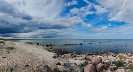 Kaltene Beach is covered with glacial stones that stretches up to Roja Town in Latvia. Kaltene Beach is a great place for quite beach holidays and beach hiking.の写真素材