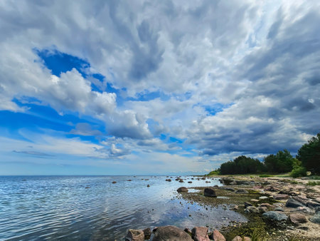 Kaltene Beach is covered with glacial stones that stretches up to Roja Town in Latvia. Kaltene Beach is a great place for quite beach holidays and beach hiking.の写真素材