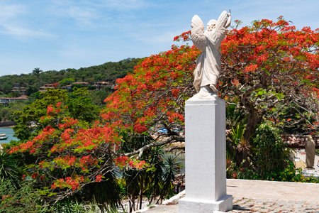Angel statue near Sant'Anna church located in Praia dos Ossos - Buzios, Rio de Janeiro, Brazil.の写真素材