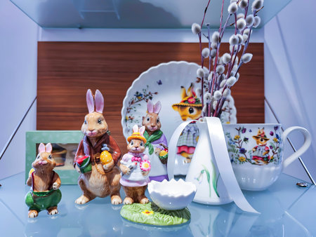 Easter table decoration with Easter bunny and rabbit figurines. Shallow depth of field.