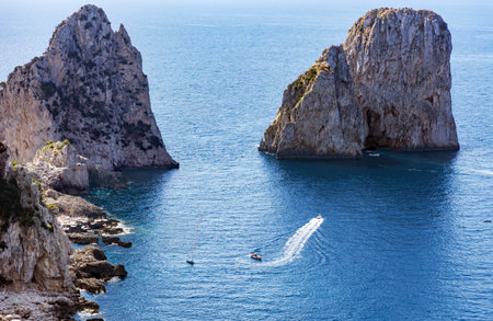 The Faraglioni Rocks on the coast of the island of Capri, Italy. Faraglioni Rocks the symbol of the island, located in the gulf of Naples, Campania.の写真素材