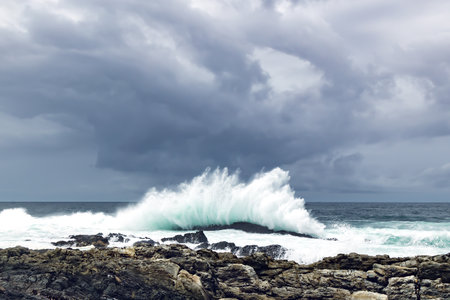 Large Indian Ocean waves and rocky coastline in Tsitsikamma, Garden Route National Park, Eastern Cape. South Africaの写真素材