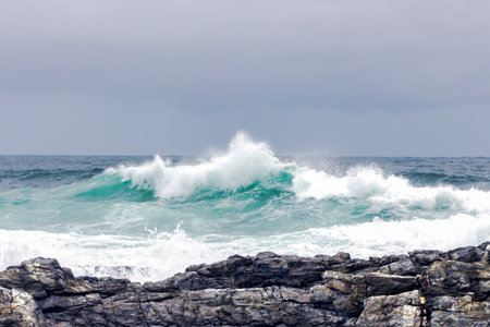 Large Indian Ocean waves and rocky coastline in Tsitsikamma, Garden Route National Park, Eastern Cape. South Africaの写真素材