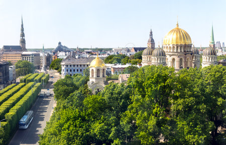 Aerial view of Riga city center with the main Orthodox Cathedral with golden domes surrounded by green trees of the park in Riga. Latviaの写真素材