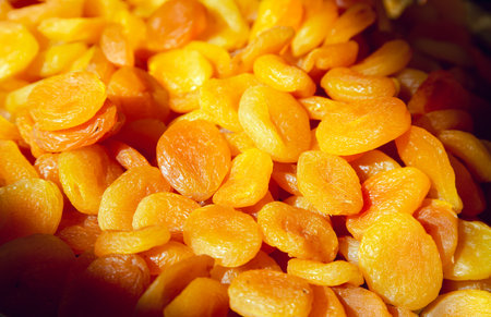 Fresh dried apricots in rays of light close-up. Organic dietary product.の写真素材