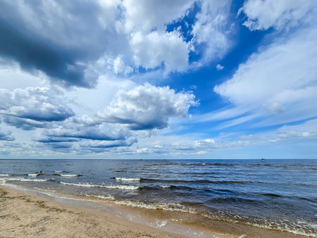 Calm Baltic Sea with clear shores and cirrus clouds in Jurmala, Latvia. Nature shot in Latvia.の写真素材
