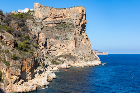 Rocky cliffs at Cala La Granadella on Mediterranean sea, Javea, Costa Blanca, Alicante Province, Spainの写真素材