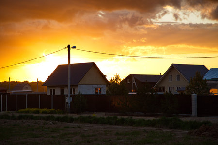 Sunset in the sky over the country settlement, Moscow region, Russia.の写真素材