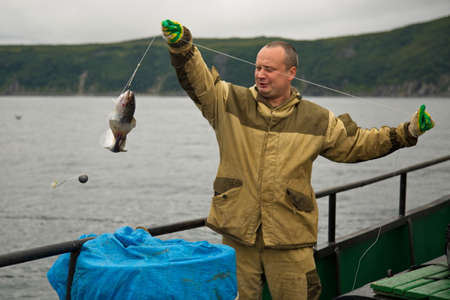 Fisherman at work, Sea of Okhotsk.の写真素材