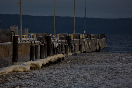 A ship dock on the shore of the frozen northern Lake Onega.の写真素材
