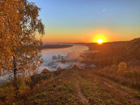 Autumn landscape of the central strip of Russia on a foggy morning.の写真素材