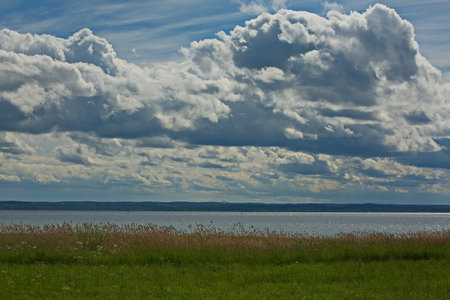 Cloudy sky over Pleshcheevo lake.の写真素材