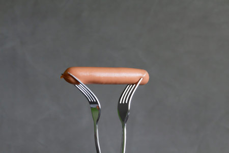 Two people in a family are forced to share a sausage for two with a fork due to lack of money and...