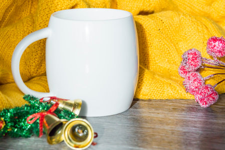 New Year and Christmas decorations and decorations with a yellow sweater on a wooden surface background. Preparation for the holiday.の写真素材