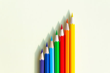 A large number of sharpened colored pencils with falling shadow from natural light on a bright sunny day.の写真素材
