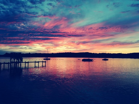 Colorful sunset over calm lakeの写真素材