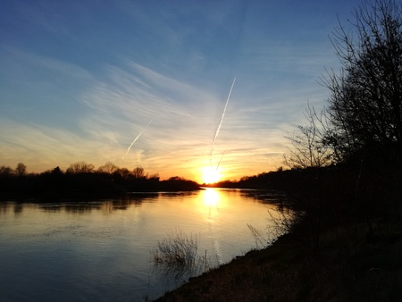 sunset over calm riverの写真素材