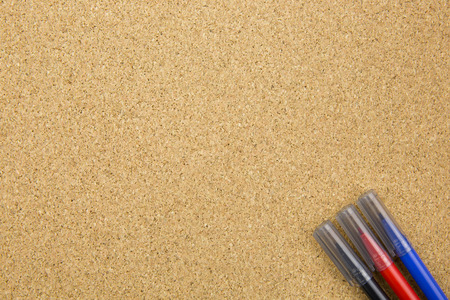 three color marker on cork boardの写真素材