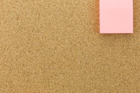 pink note on cork boardの写真素材