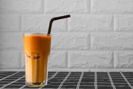 A glass of iced Thai milk tea.の写真素材