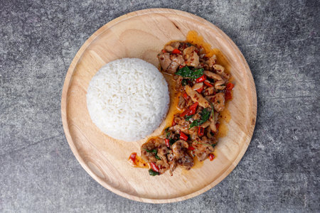 Thai street food, stir-fried pork with basil and rice.の写真素材