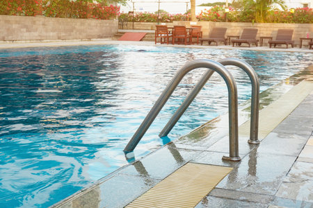 Blue swimming pool with step ladder.のeditorial素材
