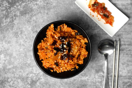 Top view Korean kimchi fried rice topping white sesame and seaweedの写真素材