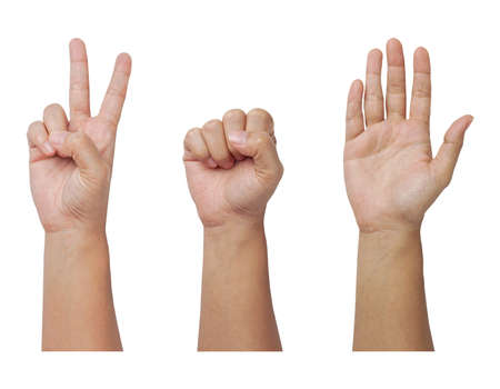 Hands sign of scissors , rock and paper game on white backgroundの写真素材