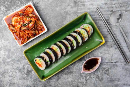 Korean food, Gimbap or Kimbap is seaweed rice roll and kimchi side dish.の写真素材