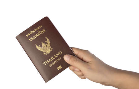 Woman hand holding Thailand passport isolated on whiteの写真素材