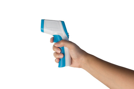 Hand holding a Thermometer gun for measuring temperature isolated on white