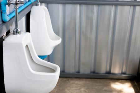 Row of outdoor urinals men public toilet.の写真素材