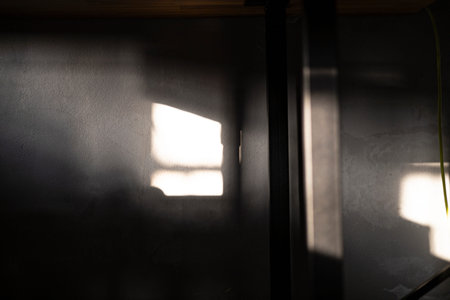 Light And Shadows Falling On The Walls In A Dark Room, Background for advertising and wallpaper in...