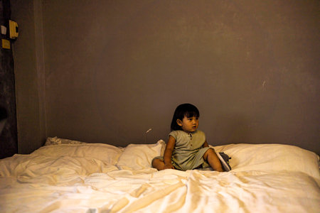 Child Is Playing On The Bed In The Bedroom, Background for advertising and wallpaper in relaxion and lifestyle scene.の写真素材